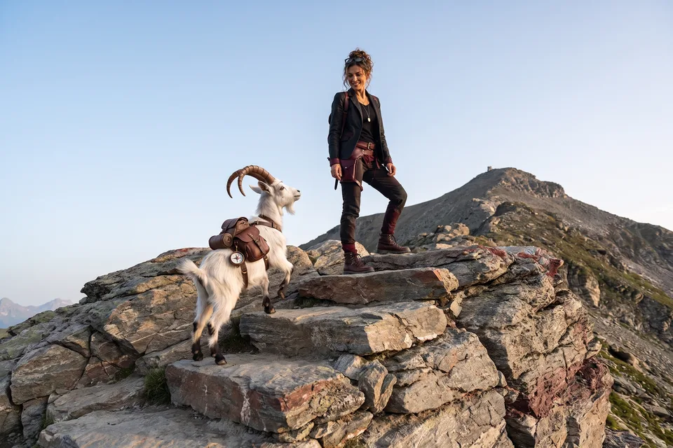 Vera and VI climbing natural rock steps towards a summit